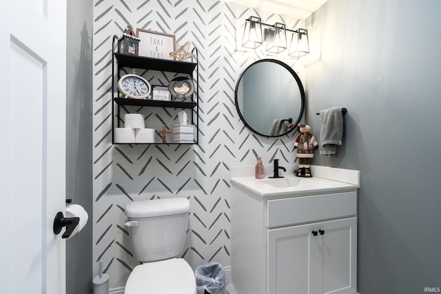 bathroom with vanity and toilet