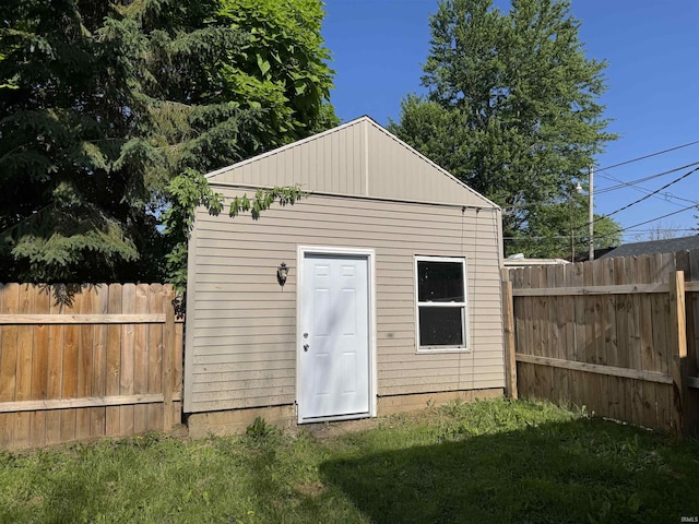 view of outbuilding with a lawn