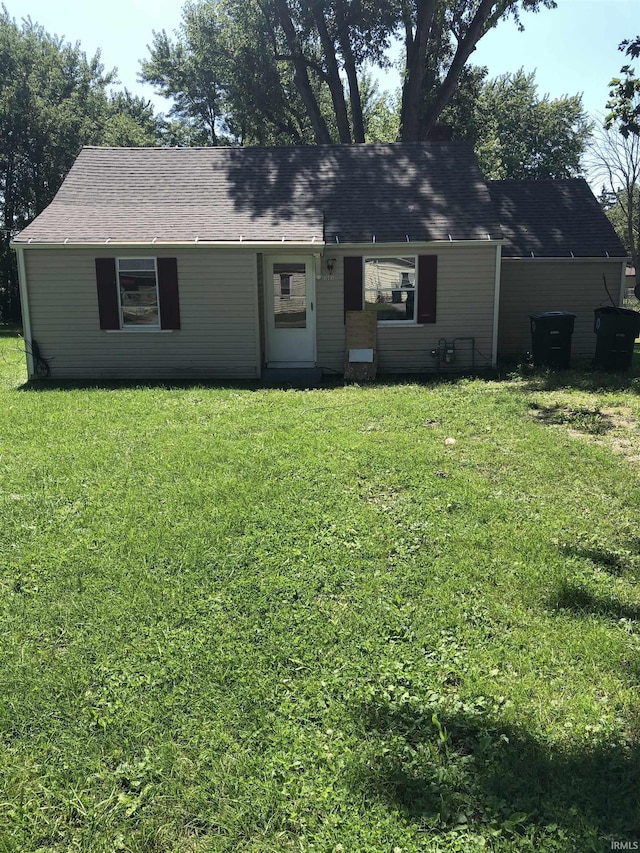 ranch-style home with a front lawn