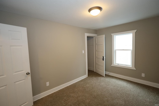 unfurnished bedroom featuring carpet