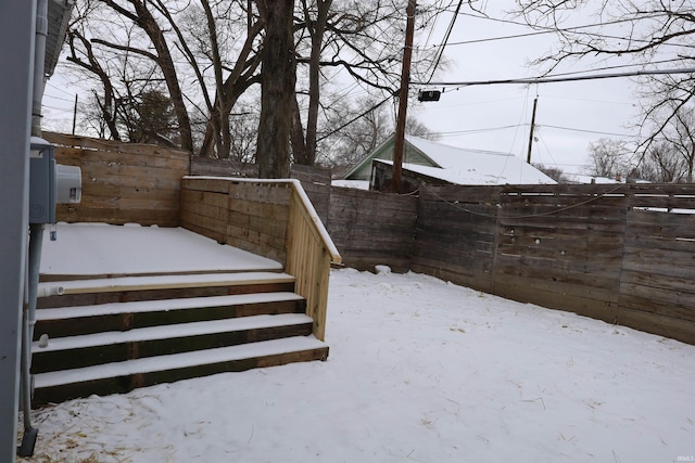 view of yard covered in snow