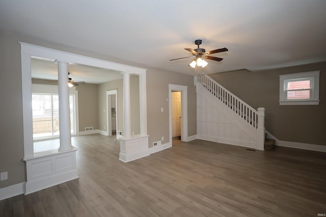 unfurnished living room with hardwood / wood-style flooring and ceiling fan