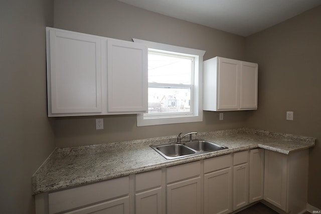 kitchen with sink and white cabinets