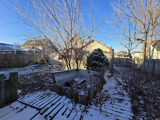 view of yard layered in snow