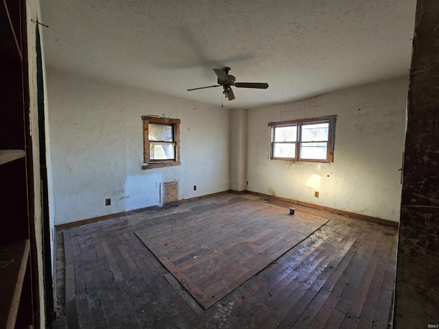 unfurnished bedroom with a textured ceiling and ceiling fan