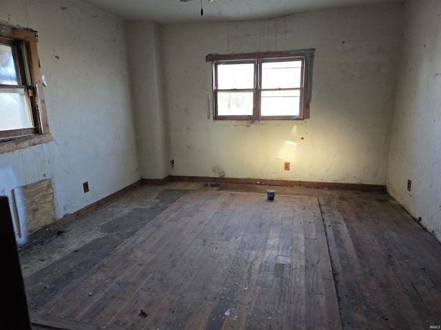 empty room featuring hardwood / wood-style flooring and ceiling fan