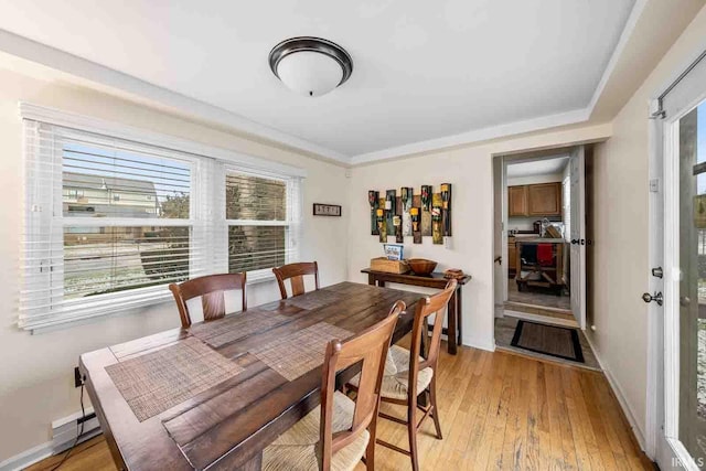 dining space featuring light wood-type flooring