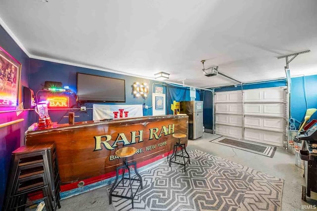 interior space featuring stainless steel fridge and concrete floors