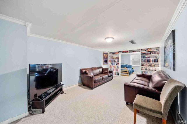 living room featuring built in shelves, carpet floors, and crown molding