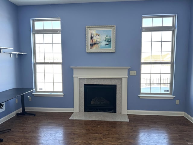 unfurnished living room with dark hardwood / wood-style floors