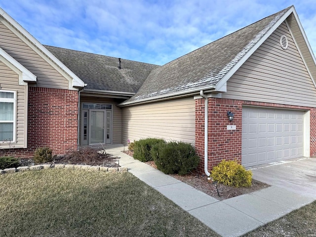 exterior space with a garage and a front lawn