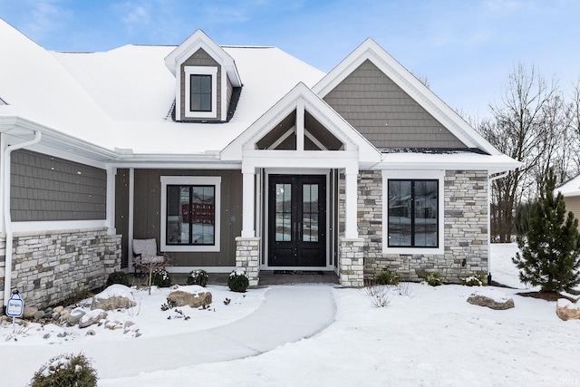 view of snow covered property entrance