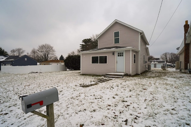 view of front of property featuring fence