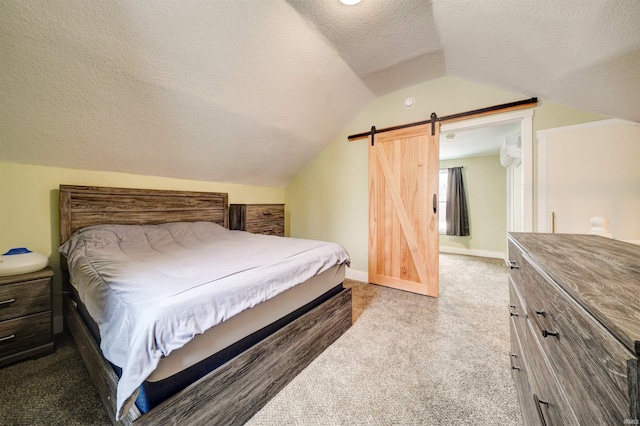 bedroom with carpet flooring, a textured ceiling, and vaulted ceiling