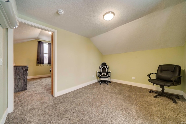 unfurnished room featuring carpet flooring, a textured ceiling, and lofted ceiling