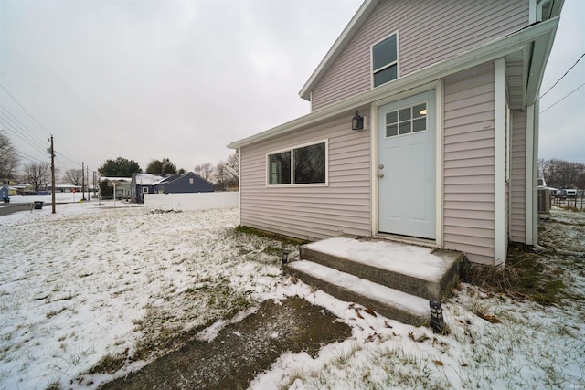 view of snow covered property entrance