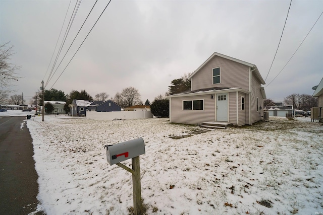 view of front of property featuring fence