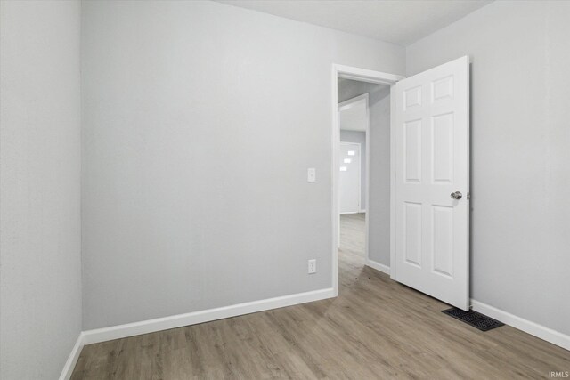 unfurnished room featuring light hardwood / wood-style flooring