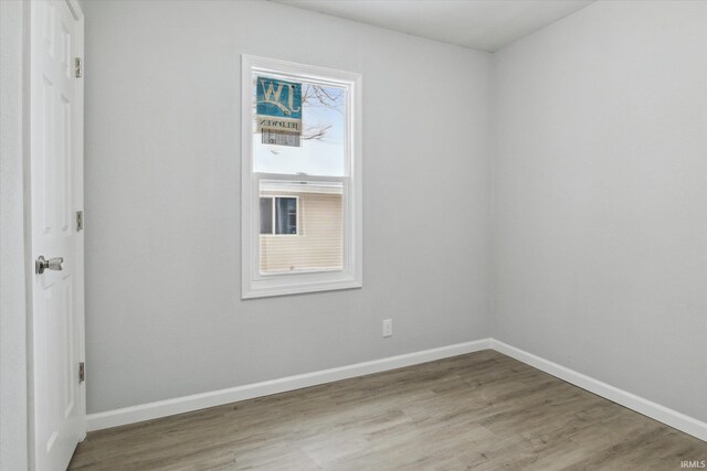 empty room with light hardwood / wood-style floors