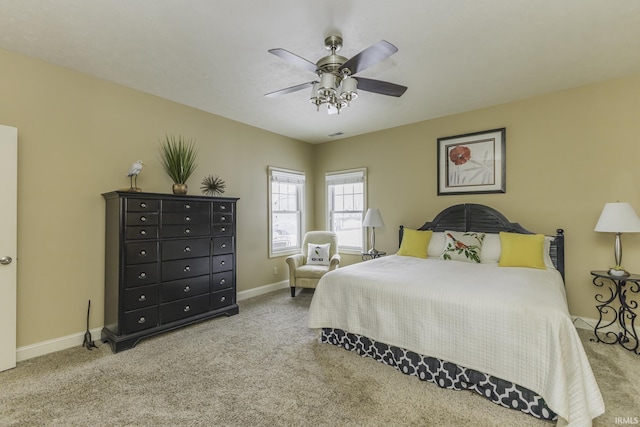 bedroom featuring ceiling fan and carpet