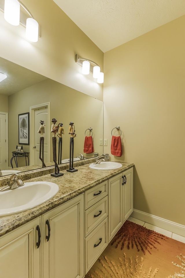 bathroom with vanity and tile patterned floors