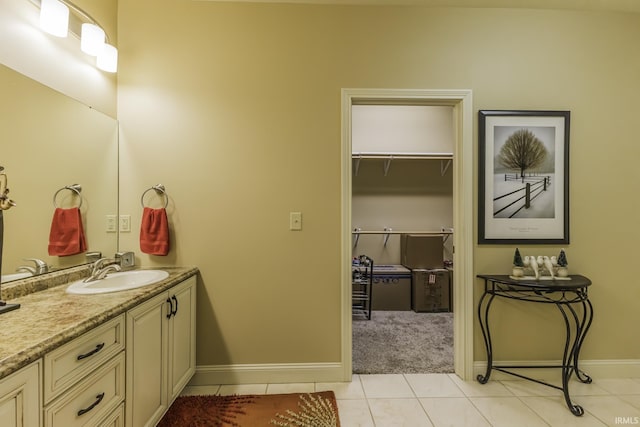 bathroom with tile patterned floors and vanity