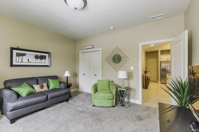 living room featuring light carpet