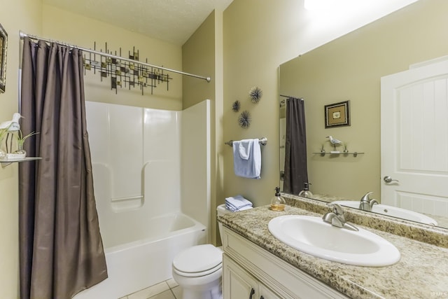 full bathroom featuring shower / bath combination with curtain, tile patterned floors, vanity, a textured ceiling, and toilet