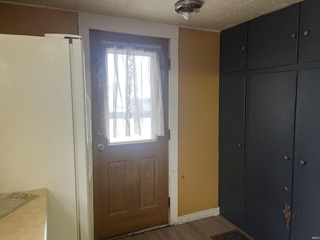 doorway featuring hardwood / wood-style flooring