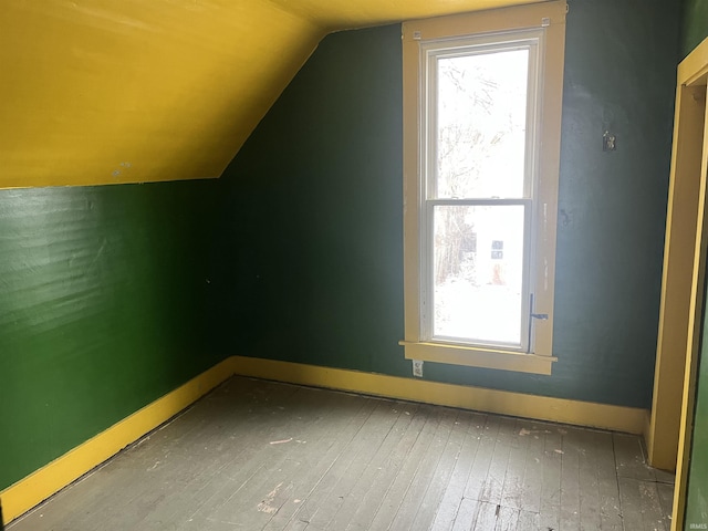 bonus room featuring hardwood / wood-style floors and lofted ceiling