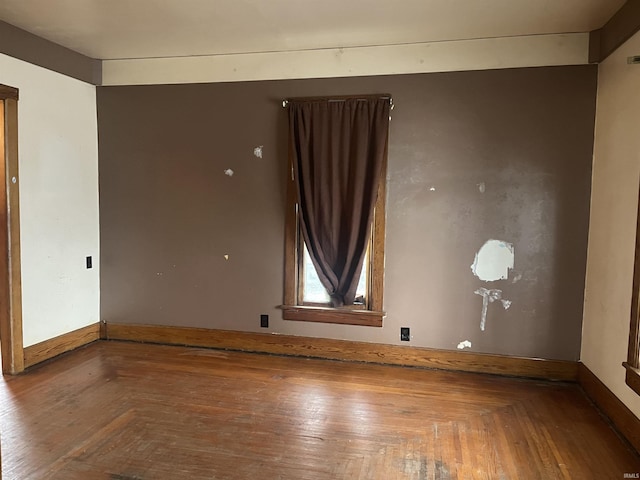 empty room with parquet flooring