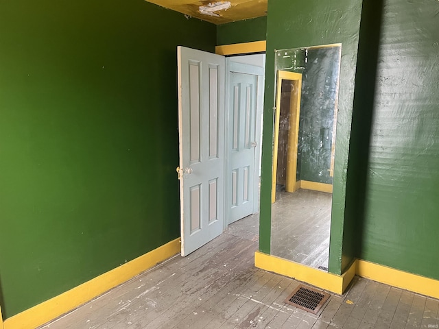 empty room featuring hardwood / wood-style floors