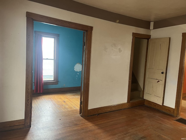 empty room featuring hardwood / wood-style flooring