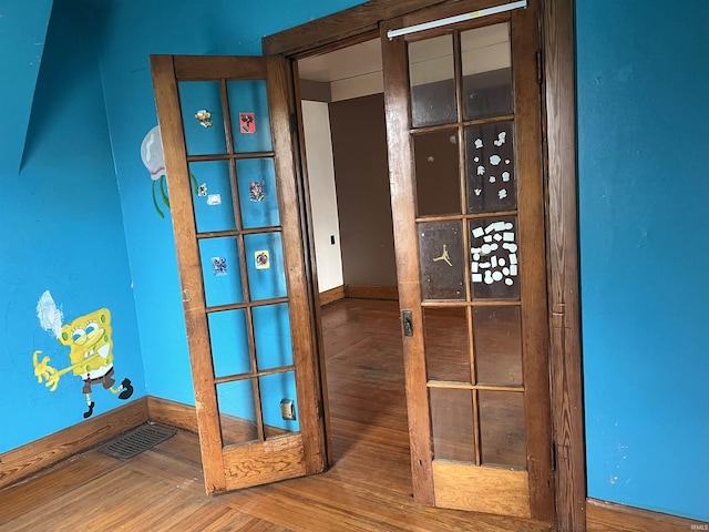 interior details featuring parquet flooring