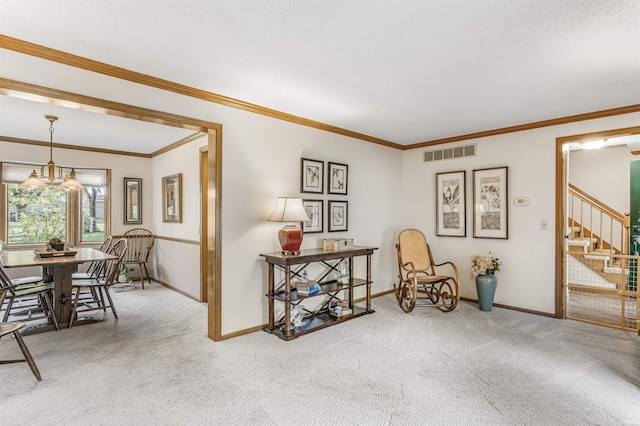 interior space featuring carpet floors, a chandelier, and ornamental molding