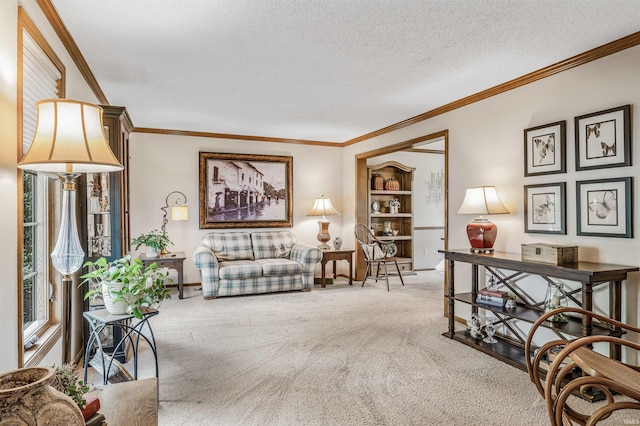 living room with carpet floors, a textured ceiling, and ornamental molding