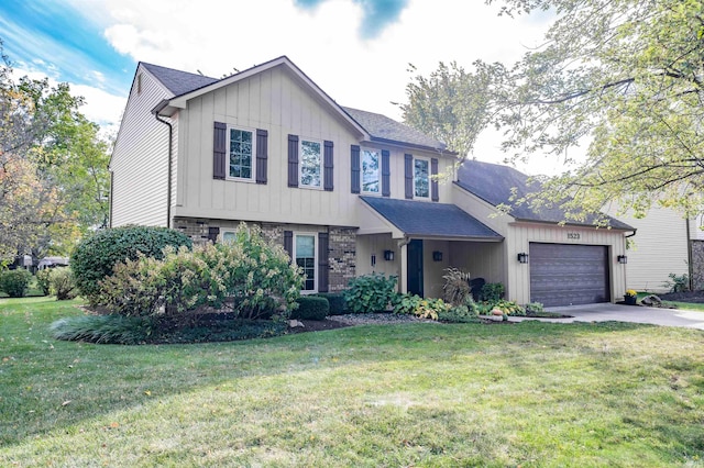 view of front facade featuring a front yard and a garage