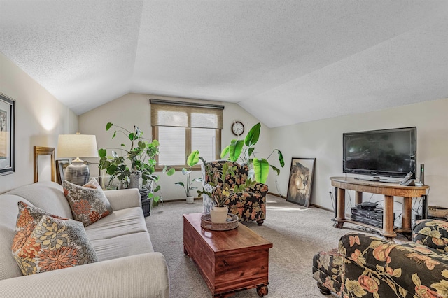 carpeted living room with a textured ceiling and vaulted ceiling