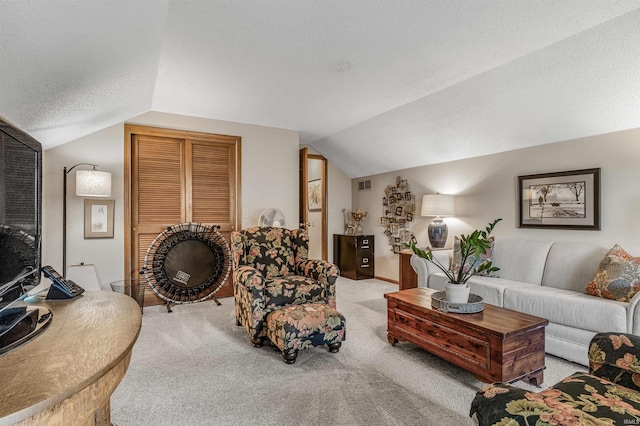 living room featuring carpet floors, a textured ceiling, and vaulted ceiling