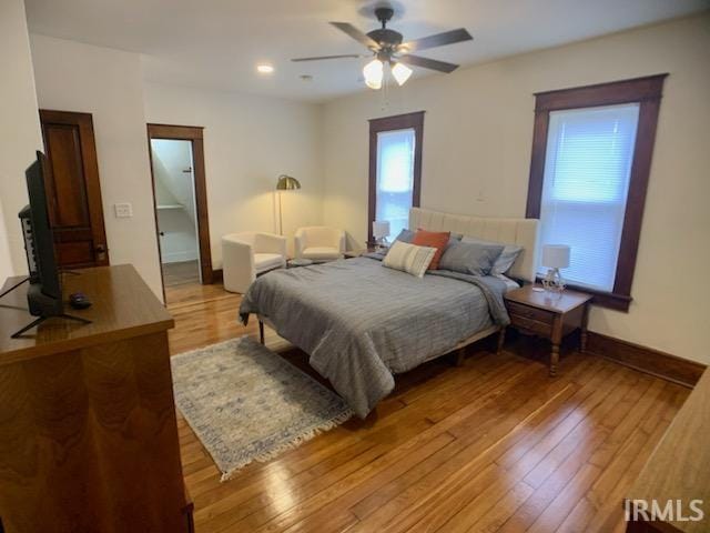 bedroom featuring light hardwood / wood-style flooring and ceiling fan