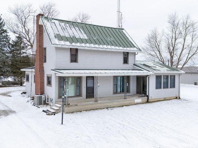 view of front facade featuring central AC and covered porch