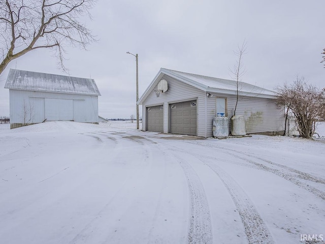 view of snow covered garage