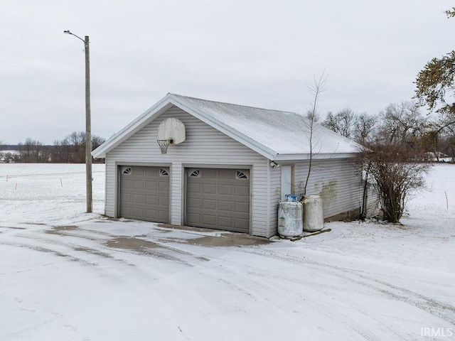 view of snow covered garage