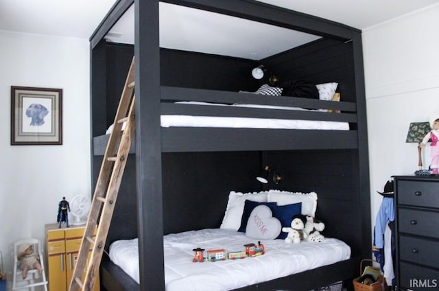 bedroom featuring crown molding