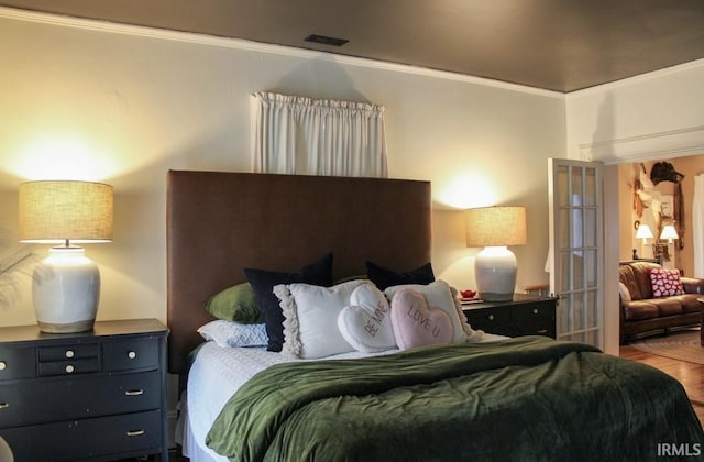 bedroom featuring ornamental molding