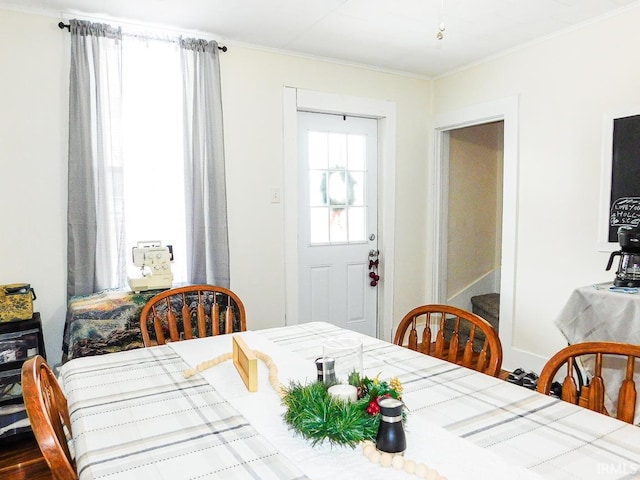 dining area featuring crown molding