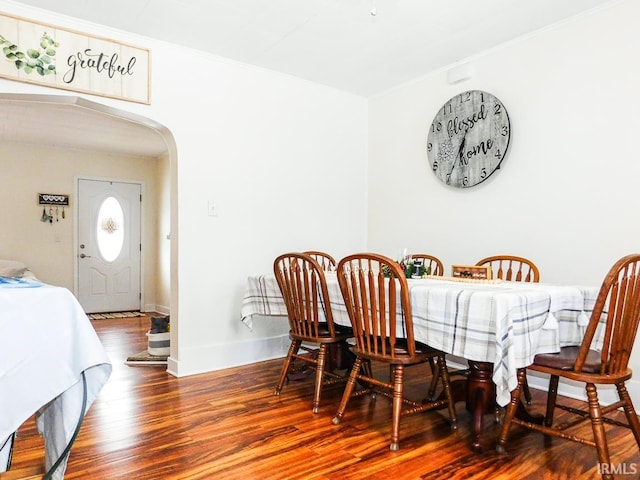 dining area featuring wood-type flooring