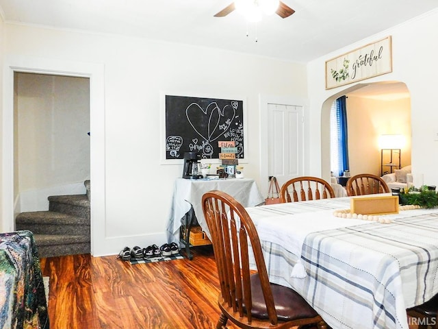 dining area with hardwood / wood-style flooring and ceiling fan