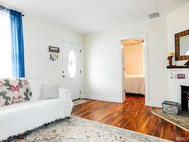 foyer entrance with hardwood / wood-style floors and ceiling fan