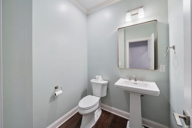 bathroom featuring hardwood / wood-style floors, toilet, and ornamental molding